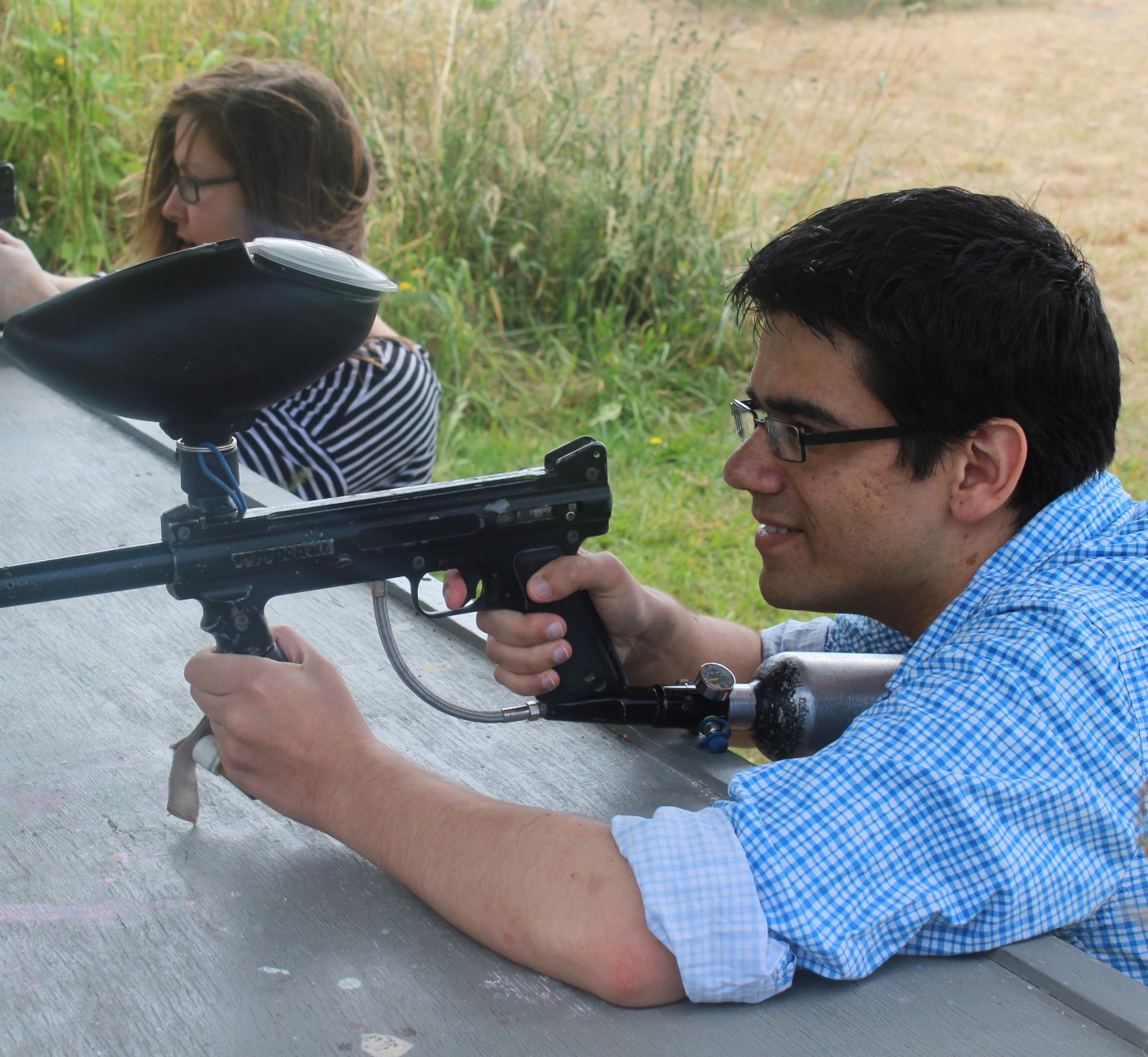 image of students paintballing